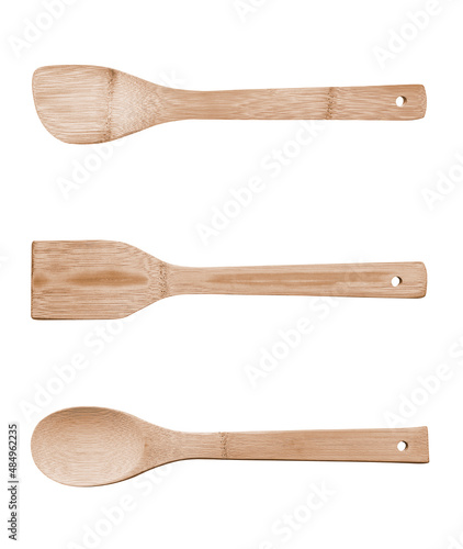 Complete set of bamboo kitchen utensils isolated against a white background