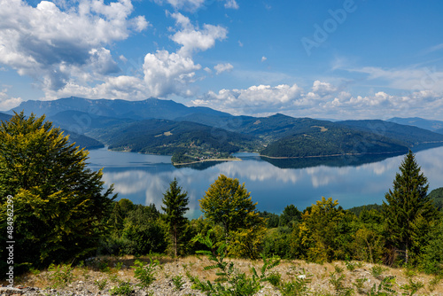 The lake Bicaz in carpathian landscape of romania photo