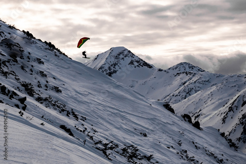 A speedrider launching off a mountain in Pirin, Balkans photo