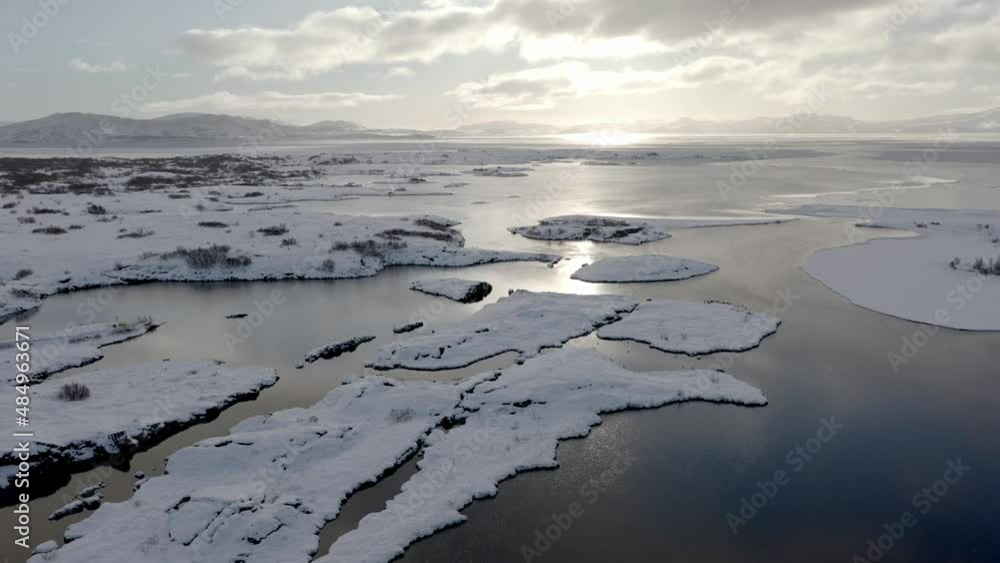 Aerial: Winter Silfra popular diving snorkelling fissure in Iceland between Eurasian and North American tectonic plates Thingvellir national park Phenomenal water clarity Aerial: Winter Silfra popular diving snorkelling fissure in Iceland between Eurasian and North American tectonic plates Thingvellir national park Phenomenal water clarity
