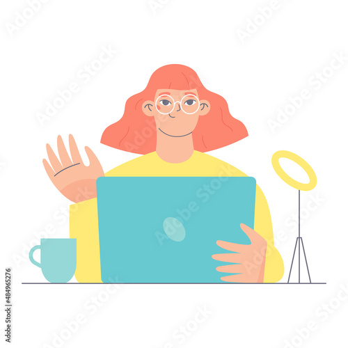 Young woman with laptop sitting at the desk and waiving her hand. Flat character vector illustration.
