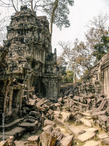Ruins of an ancient stone temple lost in the Cambodian jungle - Ta Prohm of Angkor temples