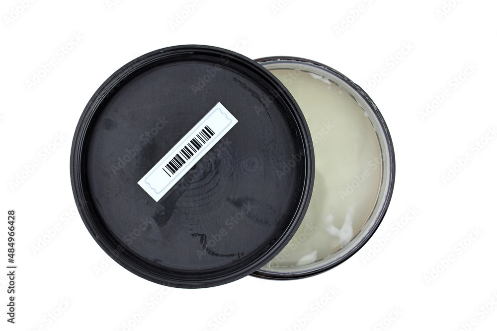 Plastic jar with lid top view. Sticker magnetic barcode on the inside of the cream jar. Plastic retail security soft tag label with random barcode