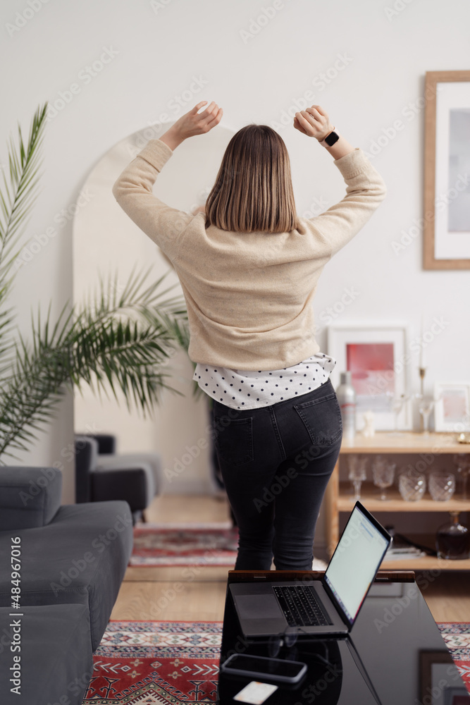 Lovely woman having a good time at home, she dances, she is happy and carefree Lovely woman having a good time at home, she dances, she is happy and carefree