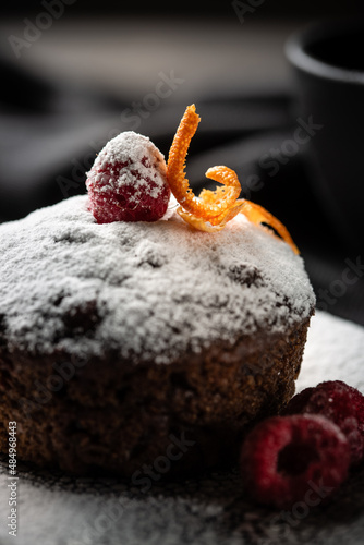 Plate of delicious fresh fondant with hot chocolate and blueberries on table. Lava cake recipe. High quality photo