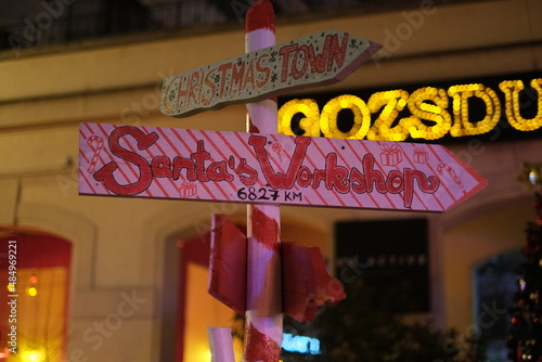 sign pointing to the santa workshop
