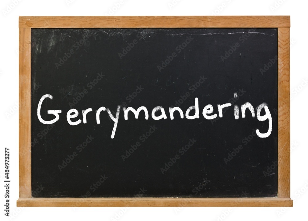 Obraz premium Gerrymandering written in white chalk on a black chalkboard isolated on white