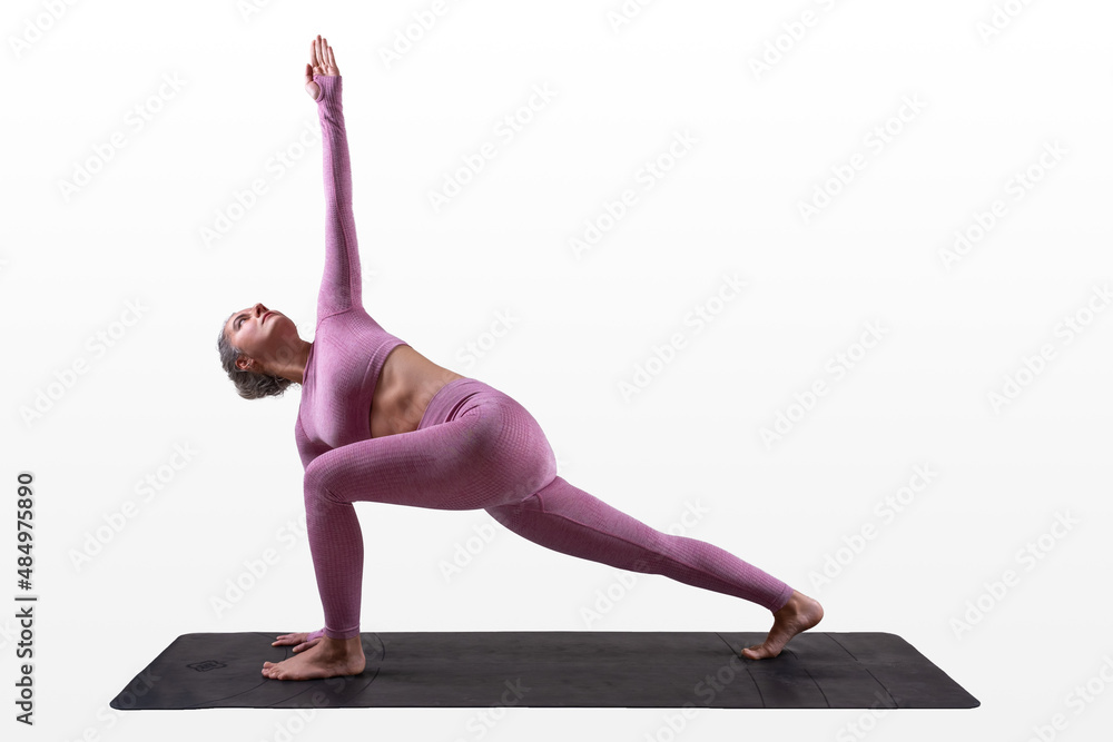 woman doing yoga - revolved crescent lunge - Parivrtta Anjaneyasana
