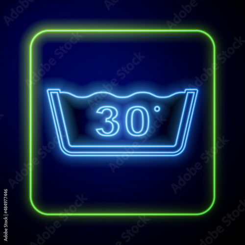 Glowing neon Washing under 30 degrees celsius icon isolated on blue background. Temperature wash. Vector