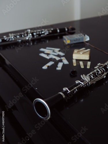 two clarinets and accessories on black 