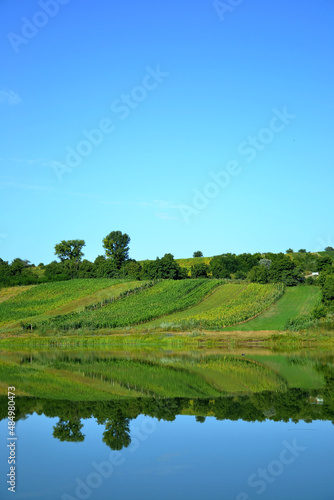 rural landscape with reflection in the lake