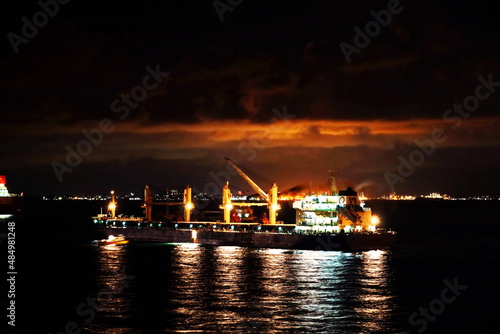 Various sunset and night views of the coastline and cityscape of the Port of Singapore.  © masterskuz55