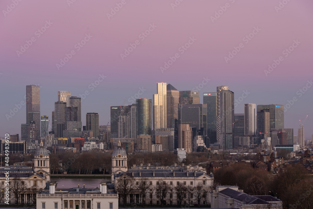 LONDON, JANUARY 30, 2022 - Epic sunrise view of Canary Wharf in London at sunrise with beautful soft light and all landmark building visible