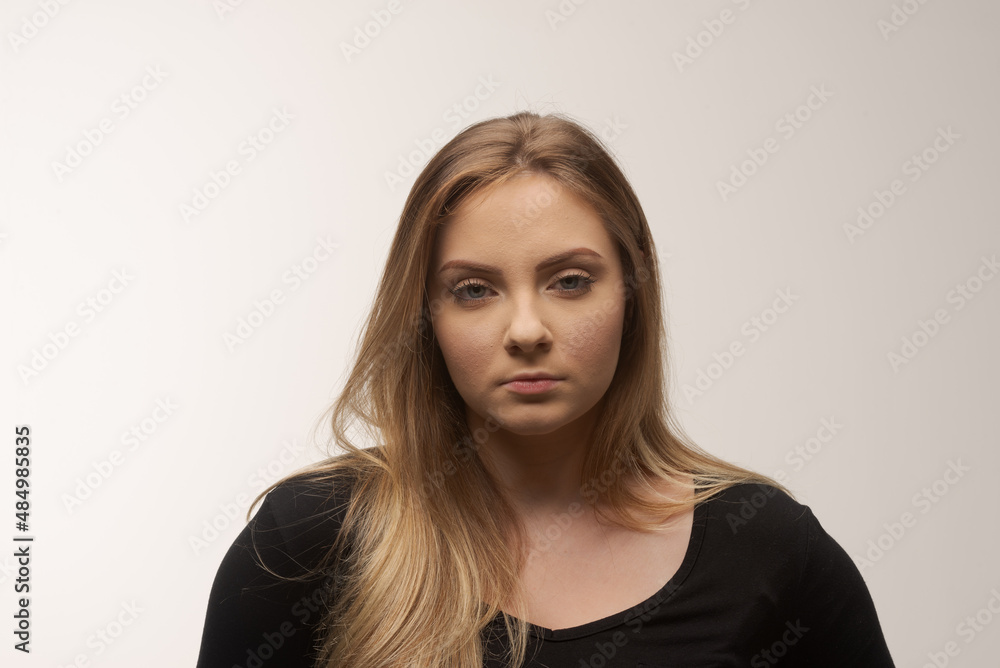 Angry young woman portrait in studio white background Angry young woman portrait in studio white background
