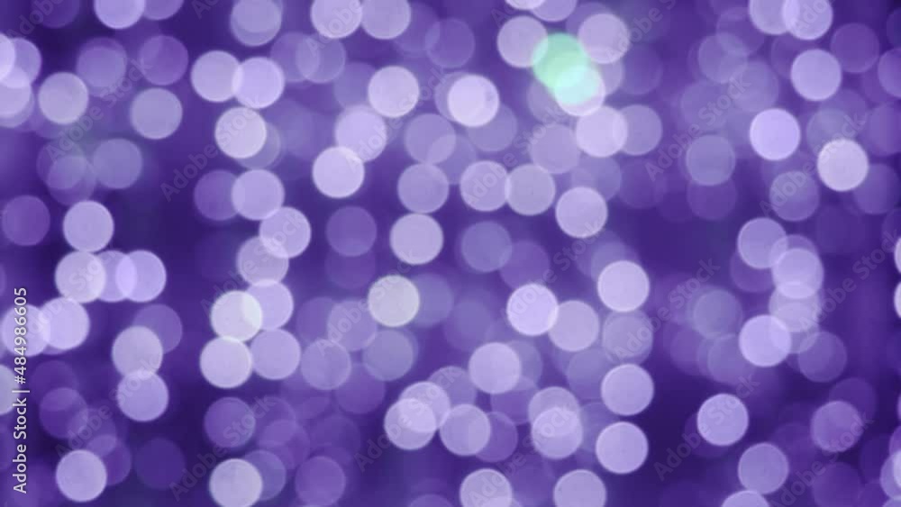 The color of 2022 is Very Peri. Lights festive background. Abstract bright background blurred bokeh, banner The color of 2022 is Very Peri. Lights festive background. Abstract bright background blurred bokeh, banner