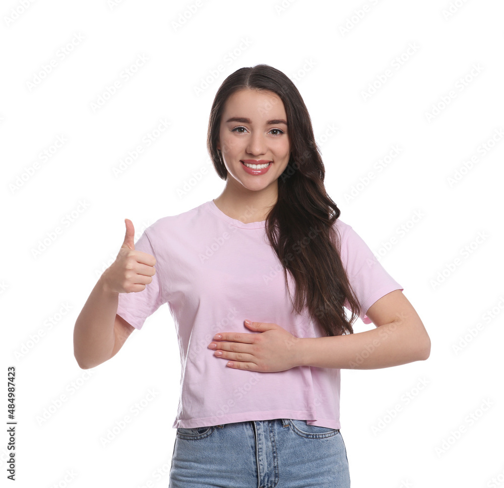 Happy healthy woman touching her belly on white background Happy healthy woman touching her belly on white background