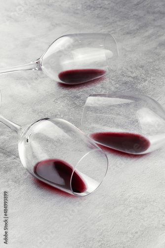Red wine glasses dropped on the table.
