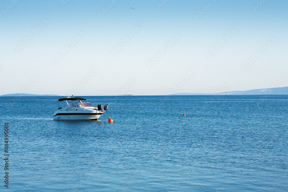 Small luxurious yacht moored at sea