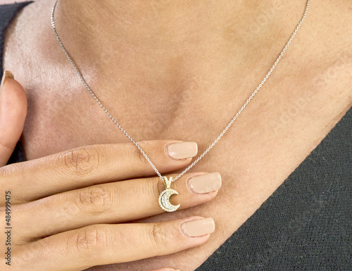 Diamond moon necklace on young lady
