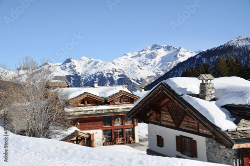 Beautiful wooden chalets in ski village in French alps. © raeva