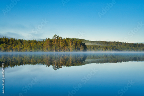beautiful swedish lake in summertime with a blue sky