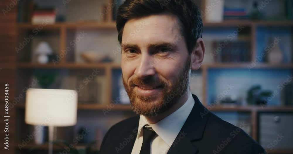 Male portrait of a manager or businessman. Handsome man in a suit, in an office with a cinematic light. Male portrait of a manager or businessman. Handsome man in a suit, in an office with a cinematic light.