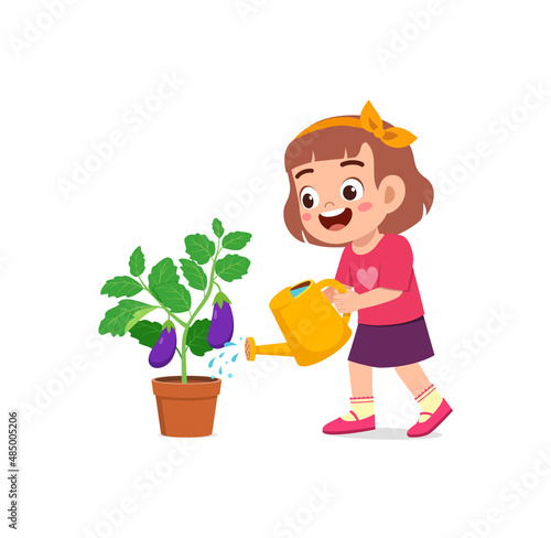 cute little girl stand and watering eggplant tree