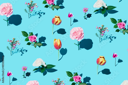 Wallpaper Mural Creative pattern made of  colourful flowers on bright blue background. Minimal Nature Trendy Decorative Design. Torontodigital.ca