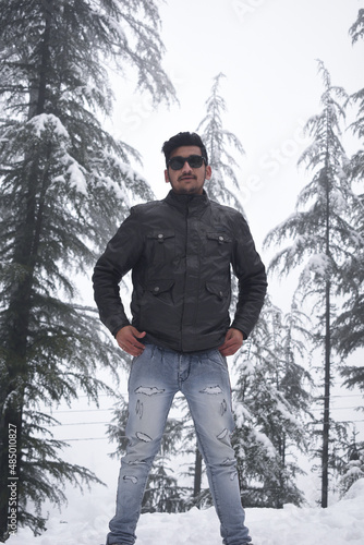 Random photo of guy in snow putting his hands in pocket