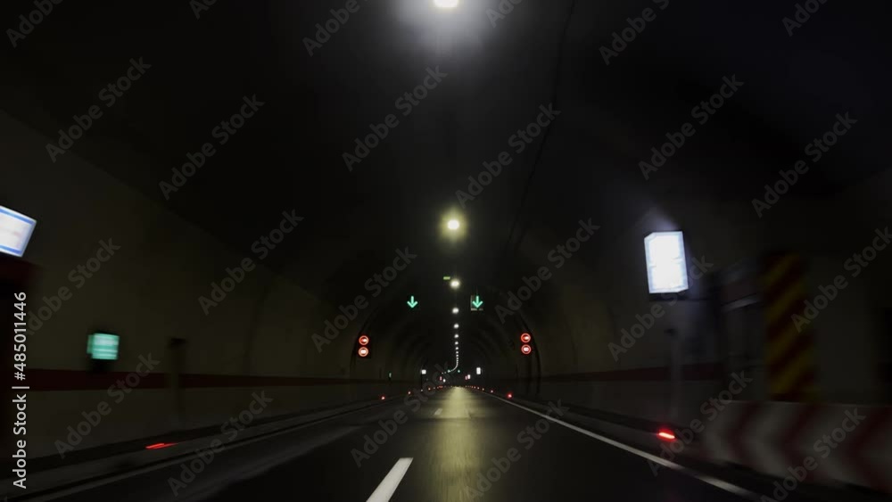 POV, Driving Plate - car driving through a tunnel with bright daylight at the end of it. POV, Driving Plate - car driving through a tunnel with bright daylight at the end of it.