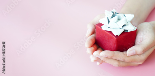 banner woman raising her hand to wrap a gift Christmas gifts for special occasions