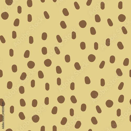Seamless pattern with hand drawn spots. Pastel doodle illustration on a beige background. Vector background with animal print cute blots.