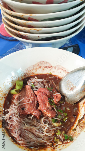 Braised beef clear noodle with meat ball soup stew photo