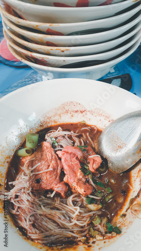 Braised beef clear noodle with meat ball soup stew photo