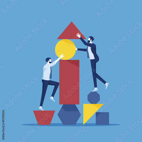 teamwork arranging abstract geometric shapes, concept of good cooperation and teamwork