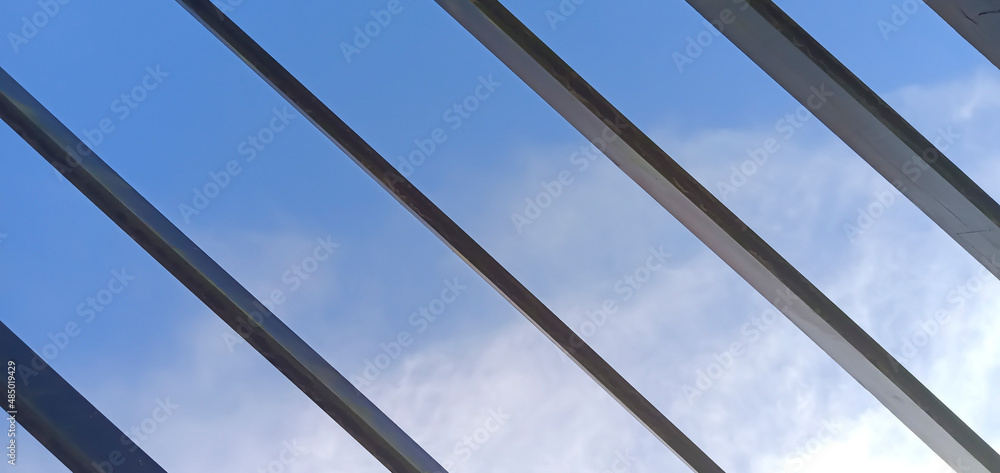 Beautiful blue sky background with a diagonal line of wood Beautiful blue sky background with a diagonal line of wood