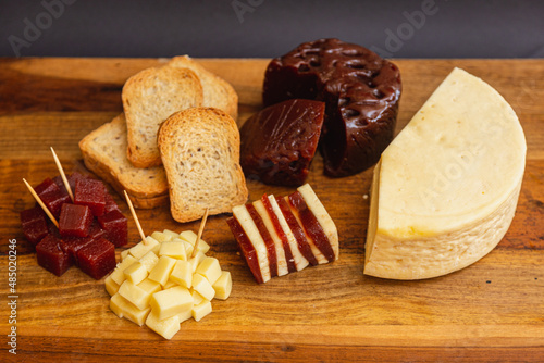 Dessert and snack of Sweet, romeo and juliet, Cheese with guava on wooden board and black background photo