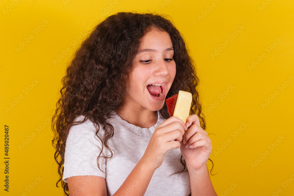 Φωτογραφία Afro-Brazilian, latin-american girl with curly hair smiling, holding skewers of