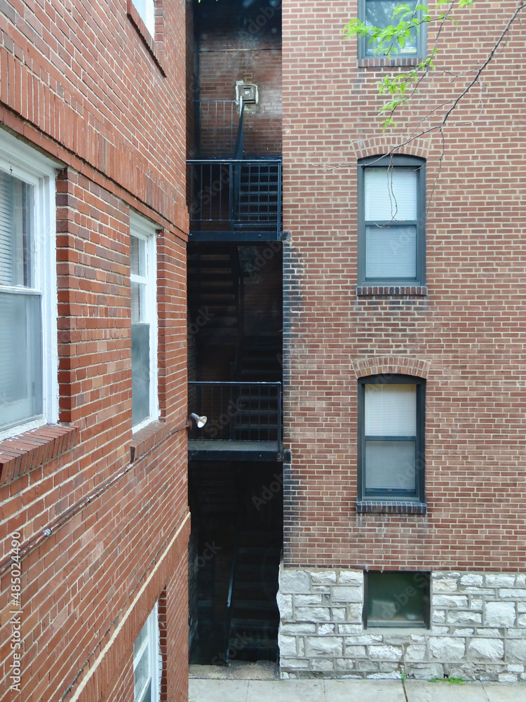 Two brick apartment buildings and fire escape
