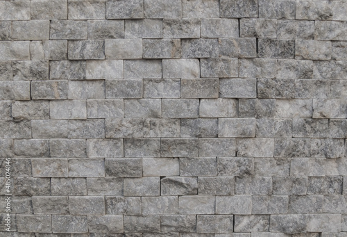 Wall of pieces of natural stone as a background