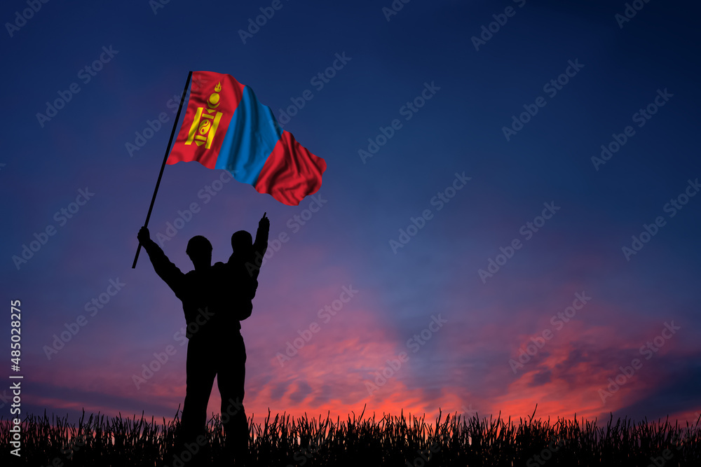 Father and son hold the flag of Mongolia