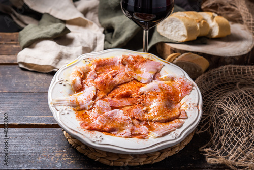 Typical Spanish tapa, Galician lacón, cut pork, with potatoes, paprika and olive oil. Appetizer, lunch or dinner.