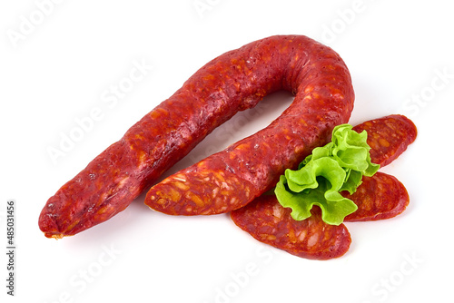 Spanish pork chorizo sausage, close-up, isolated on white background.
