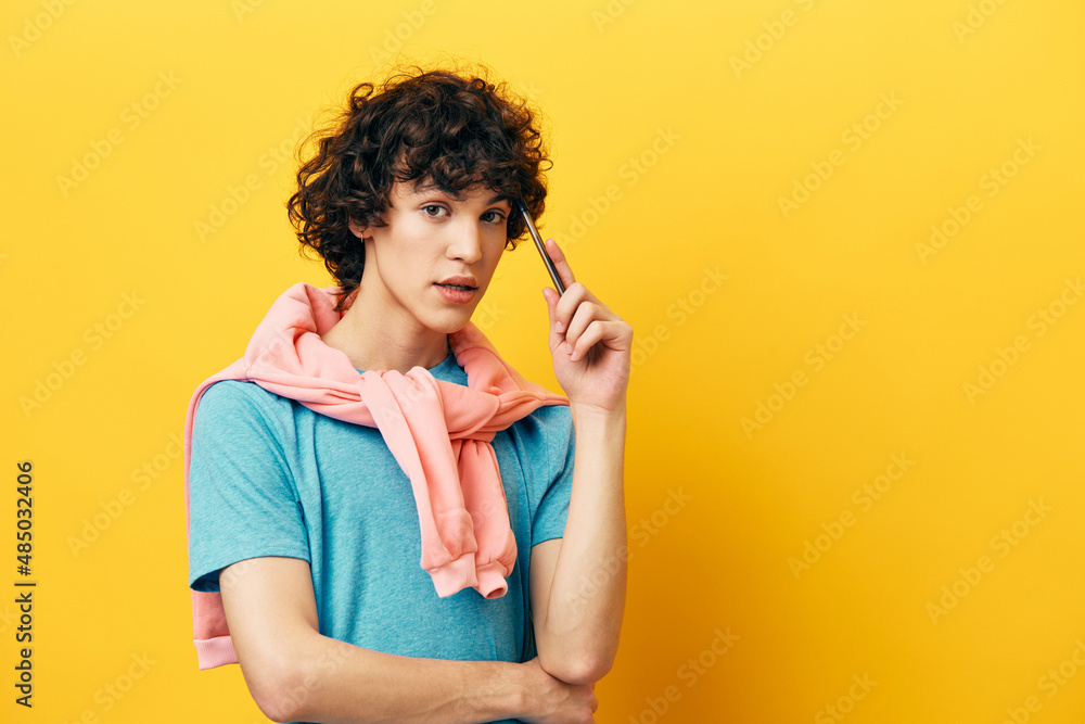 student thinks with a pen in his hands isolated backgrounds student thinks with a pen in his hands isolated backgrounds