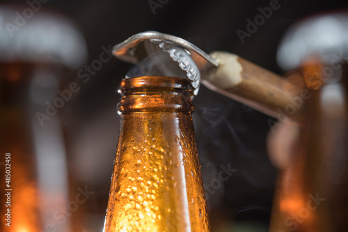 closeup photo of beer bottle cap opening