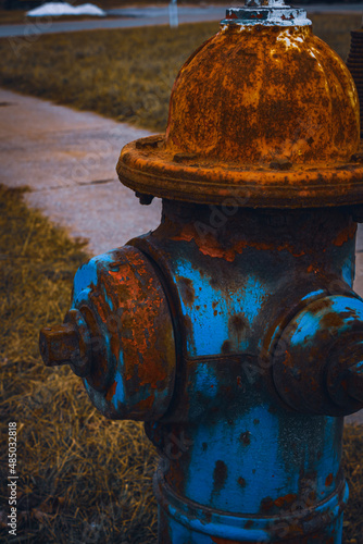 A rusted fire hydrant on the side of a road in Middlefield, Ohio