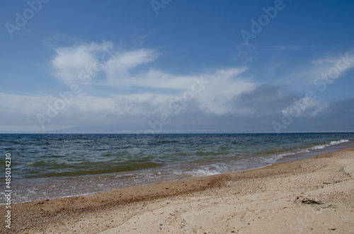 The shore of Lake Baikal in sunny summer weather.