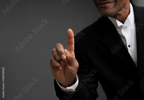 businessman pointing his finger in the office with a suit stock photo