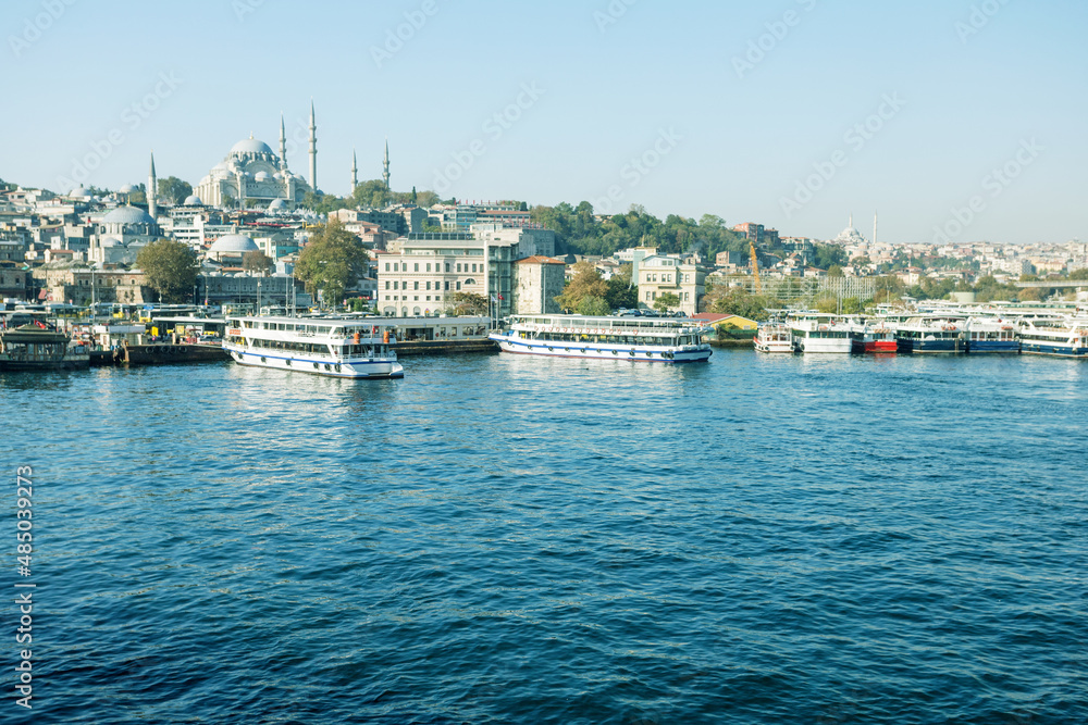 View of the old town with passenger ships on waterfront, historical building. Summer vacation in Turkey.