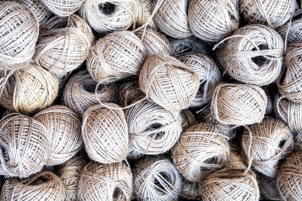 Top view of balls of thread. Many  balls of wool knitting yarn.